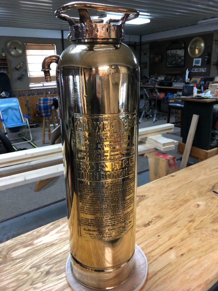 brass fire extinguisher coated with ProtectaClear to prevent tarnish and smudgy fingermarks